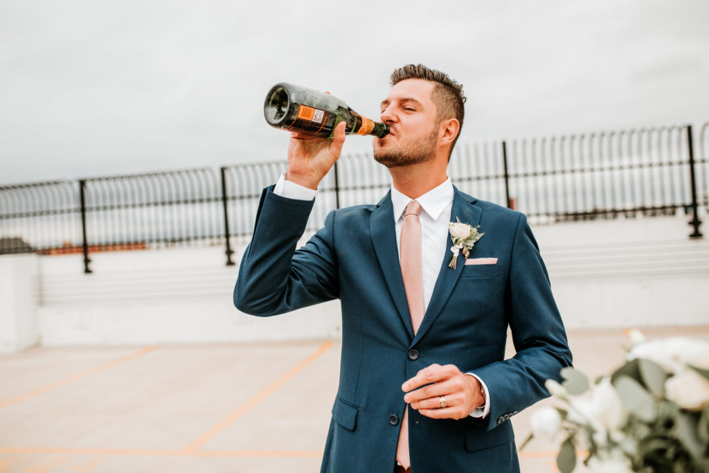 City Flats Wedding groom with champagne