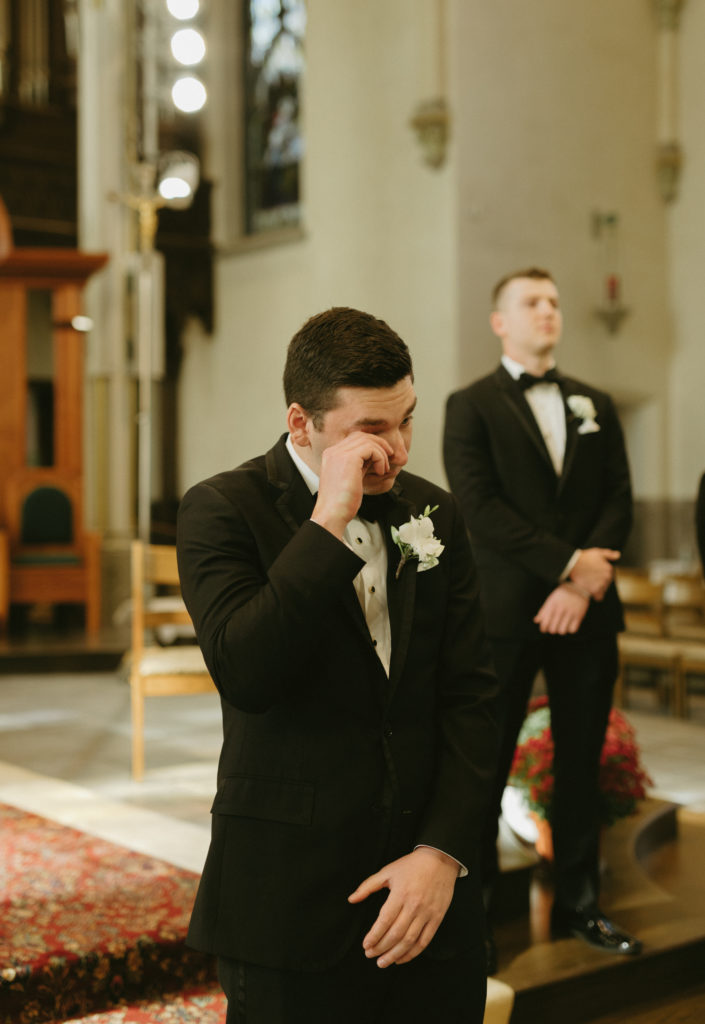 groom at Cathedral of St. Andrew wedding ceremony