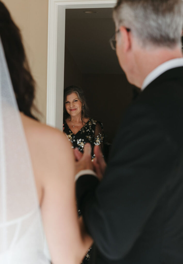 Bride and dad first look mom shot