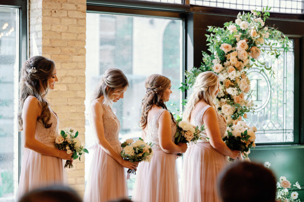 bridal party line up during ceremony
